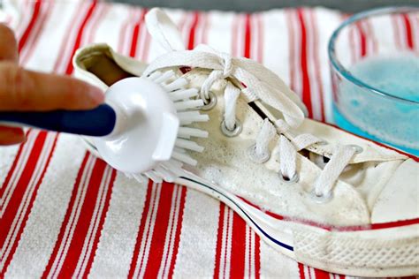 cleaning canvas shoes by hand.